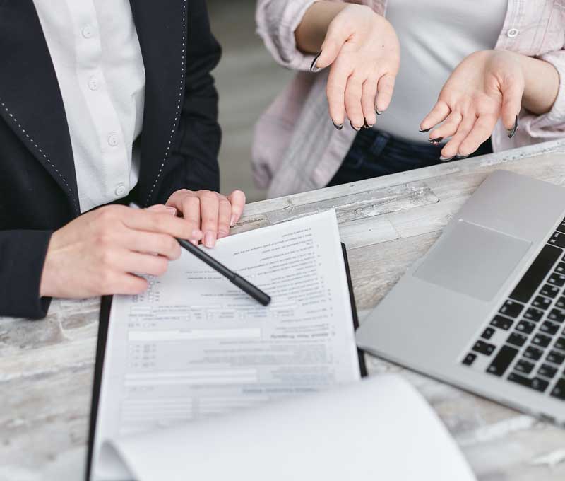 two people reviewing official forms